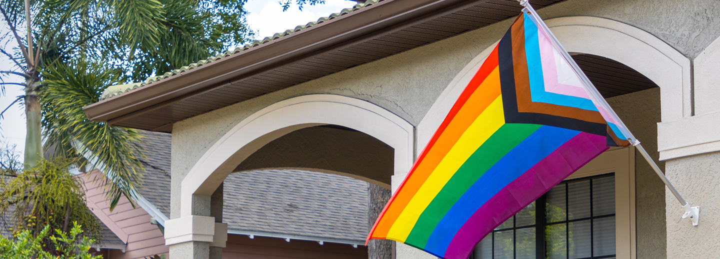 Photo of progress pride flag on display outside of home.