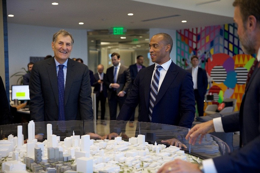Project leaders show Secretary Turner a model of the long-term plan for the Centennial Yards development. Project leaders show Secretary Turner a model of the long-term plan for the Centennial Yards development.