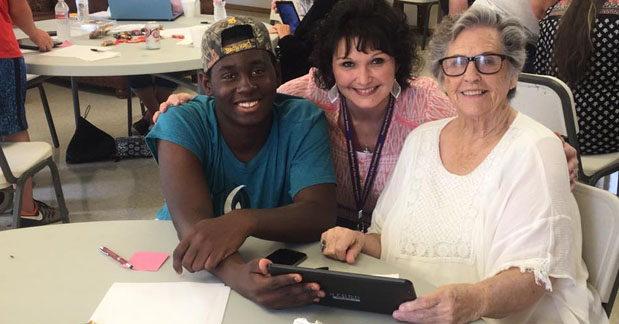 Elders People being helped to complete Health Care applications