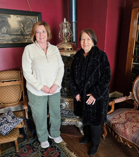 [(L-R) Iowa State Director Julie Sleeper is joined by Multifamily Southwest Account Executive Pam Dodge for a tour of the Jordan House in Des Moines, Iowa; part of the Underground Railroad used in the 19th century on February 16, 2024. (Photo credit: HUD Great Plains)]