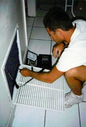 Photo: Clean air-conditioner coils regularly.